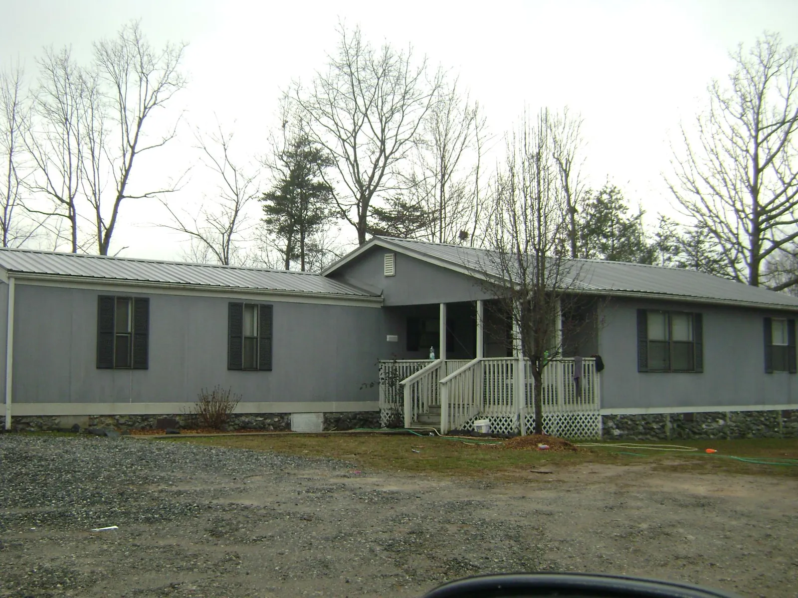 Metal roof over a manufactured home with a covered front porch in Reedville